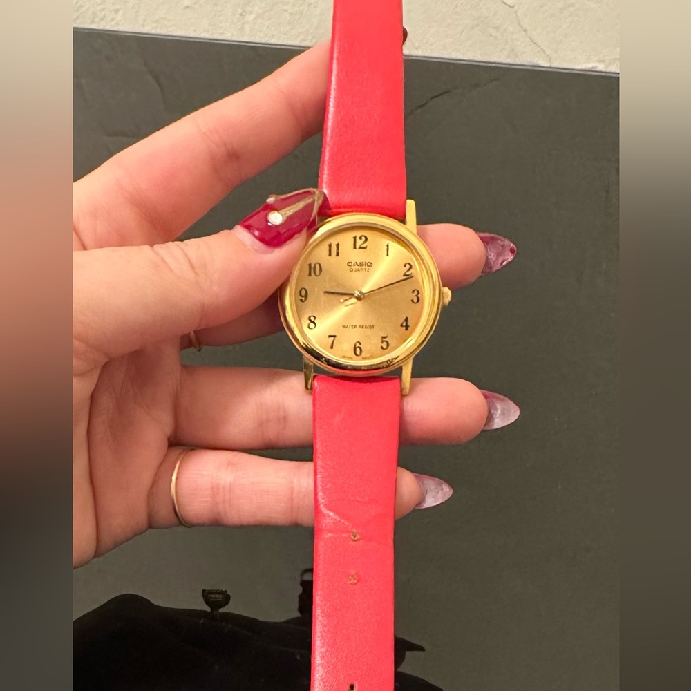 Authentic Casio watch with original red strap.